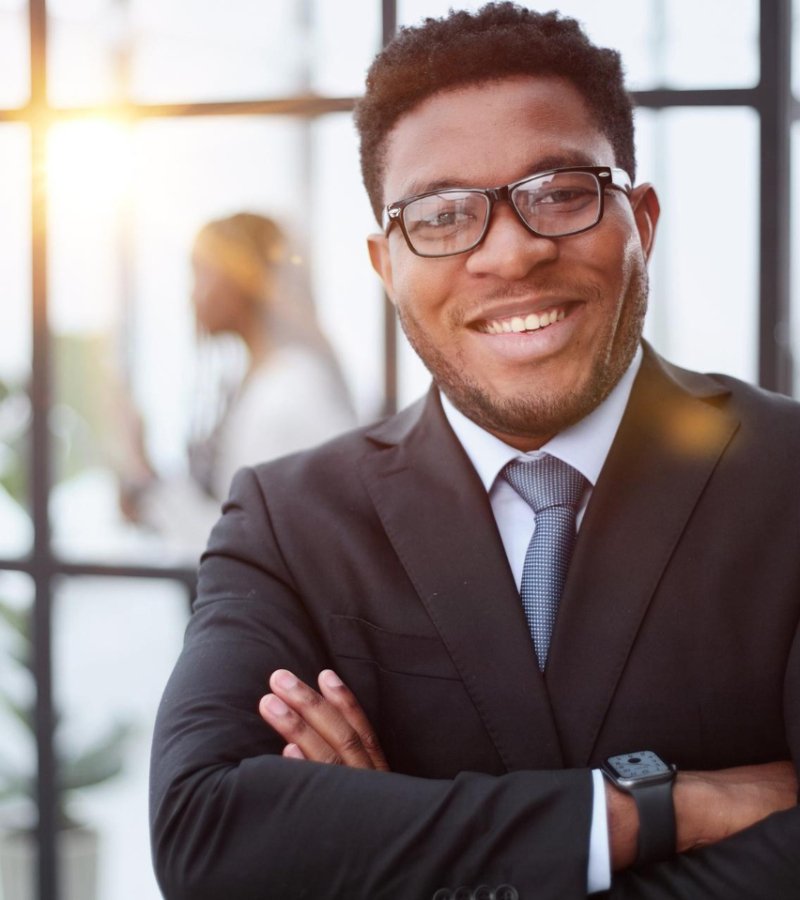 attractive-guy-with-charming-smile-glasses-with-arms-folded-front